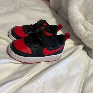Red and black children’s Nike
